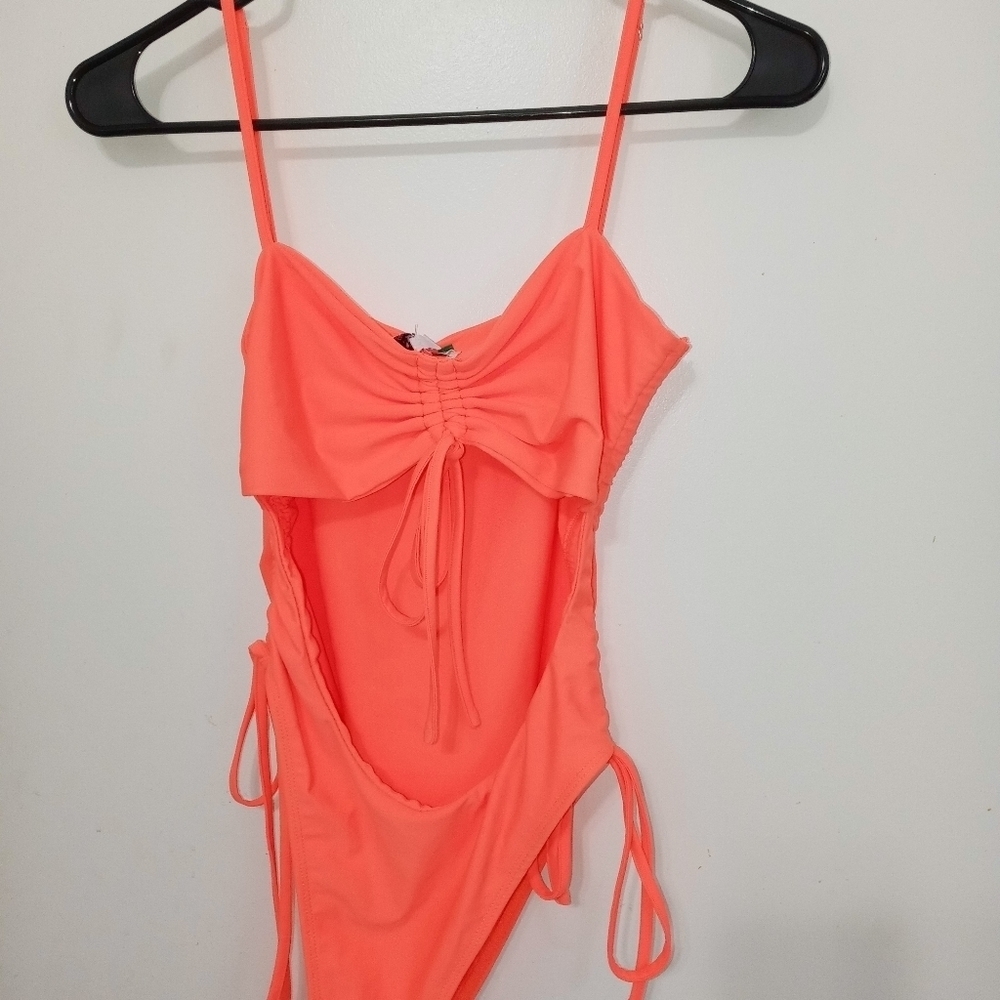 Hot & Delicious 1 Piece Bathing Suit. Open at Stomach.